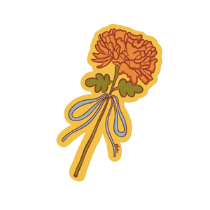 Decorative sticker of a flower with a yellow border on a light beige background